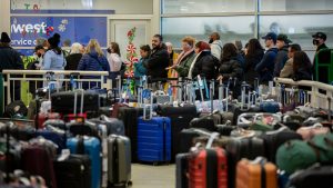 Travelers search for their luggage at the Southwest Airlines Baggage Claim at Midway Airport on December 27, 2022 in Chicago, Illinois.